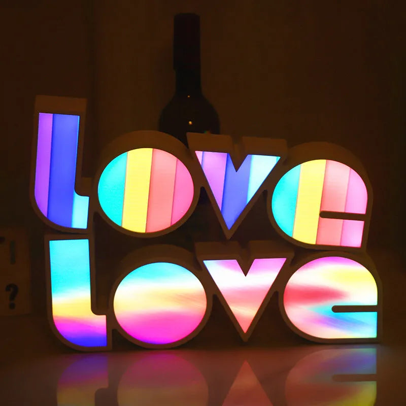 LED decorative light with rainbow-coloured LOVE word on plastic shade