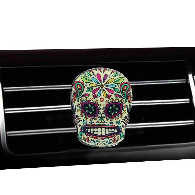 Skull-shaped acrylic car air freshener vent clip with mixed fragrance, 3.5-4.5 cm, colour option shown.