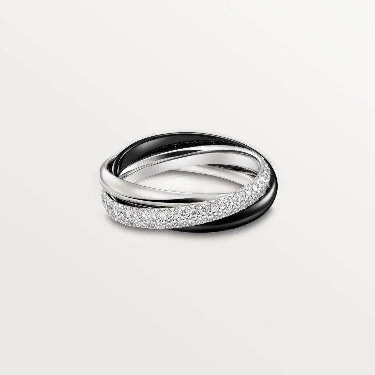 A silver couple ring with a full diamond band on a finger, showing geometric shape and personalised text engraving.