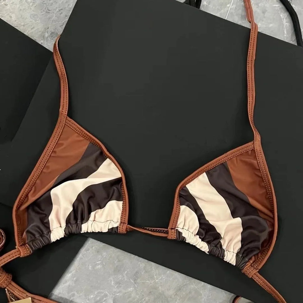 Women's black and white floral bikini set made from polyester fibre, available in sizes S M L XL