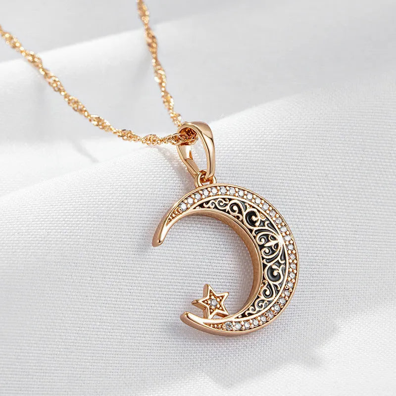 Rose gold star and moon necklace with enamel detailing on adjustable water wave chain