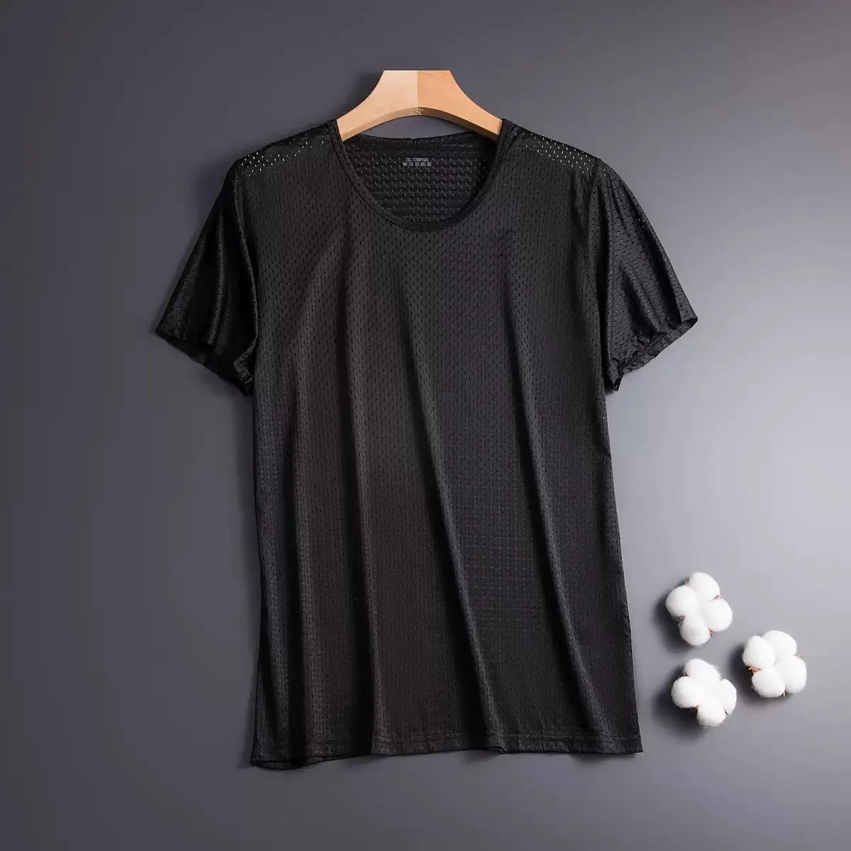 Men's solid colour ice silk short sleeve t-shirt on a hanger, showing loose crew neck and thin mesh fabric.
