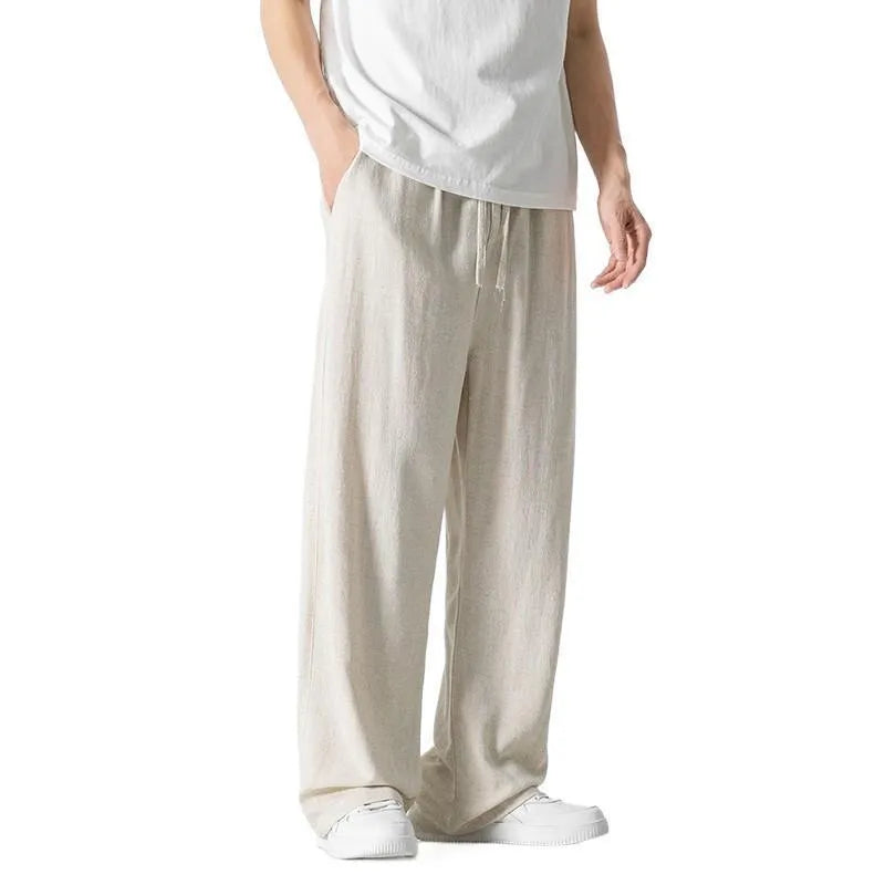 Men's cropped linen trousers in bamboo fibre with a loose straight-leg fit and drawstring waist.