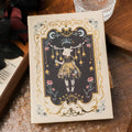 THALO A5 gothic retro art notebook showing three cover design options on wooden surface