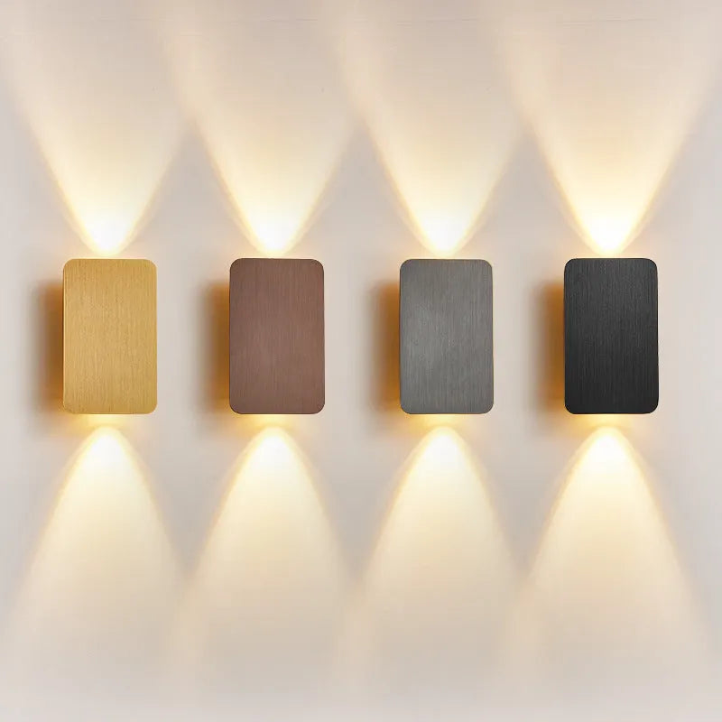 Slim minimalist Nordic-style LED wall lamp mounted on a wall, shown in a choice of colours and sizes.