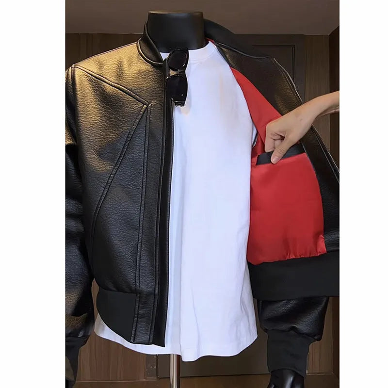 Black extended-length men's PU leather jacket with a litchi texture on a hanger.