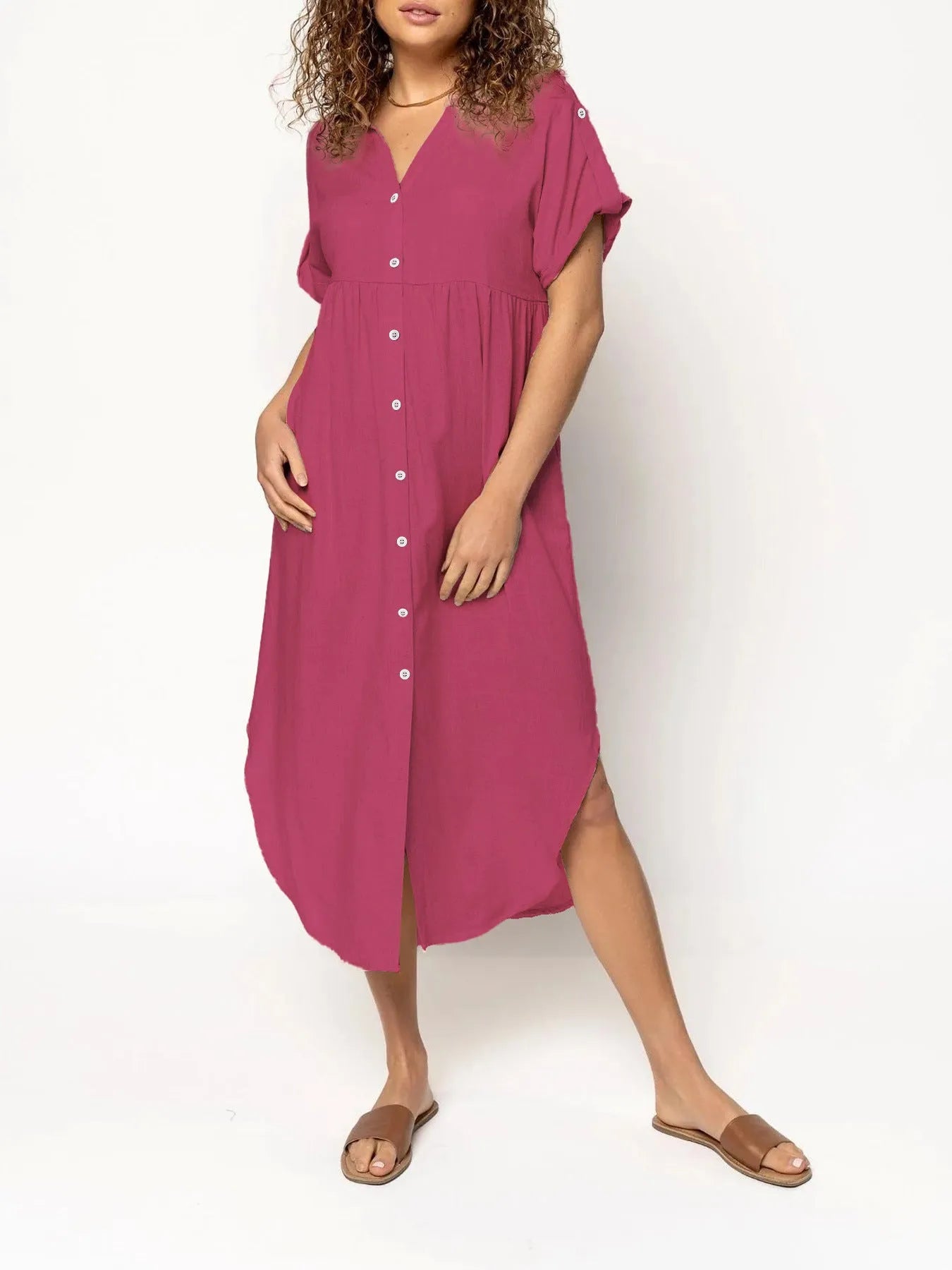 Loose-fitting casual solid colour button dress in a mid-length style on a hanger.