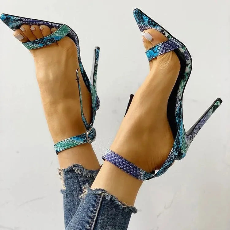 Blue women's high heels with buckle fastening and pointed toe in artificial leather