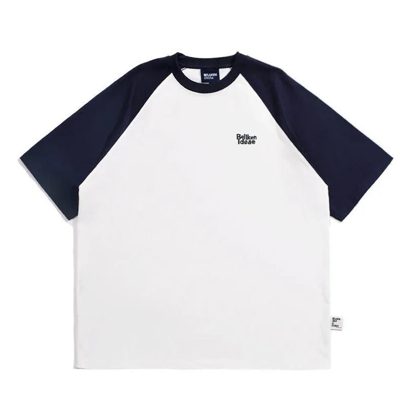 Man wearing a loose blue raglan sleeve casual t-shirt, Japanese style, thin polyester blend.