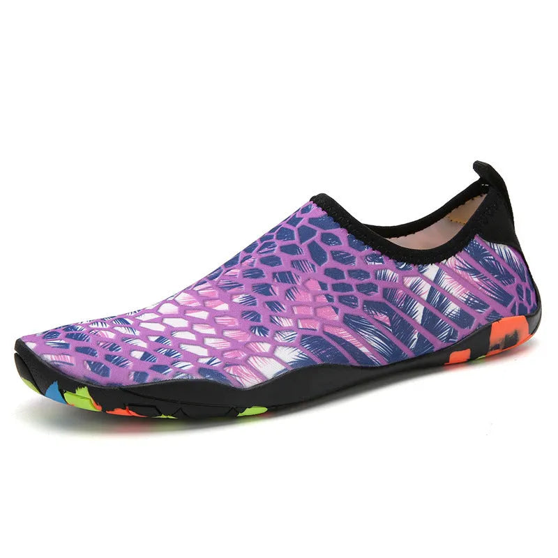 A pair of beach wading shoes for swimming, shown in camouflage colour with Lycra upper and EVA sole.