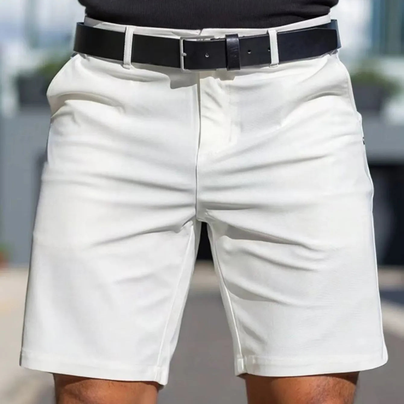 Men's straight cut solid colour shorts in light blue, showing fifth pants length and micro elastic polyester fabric.