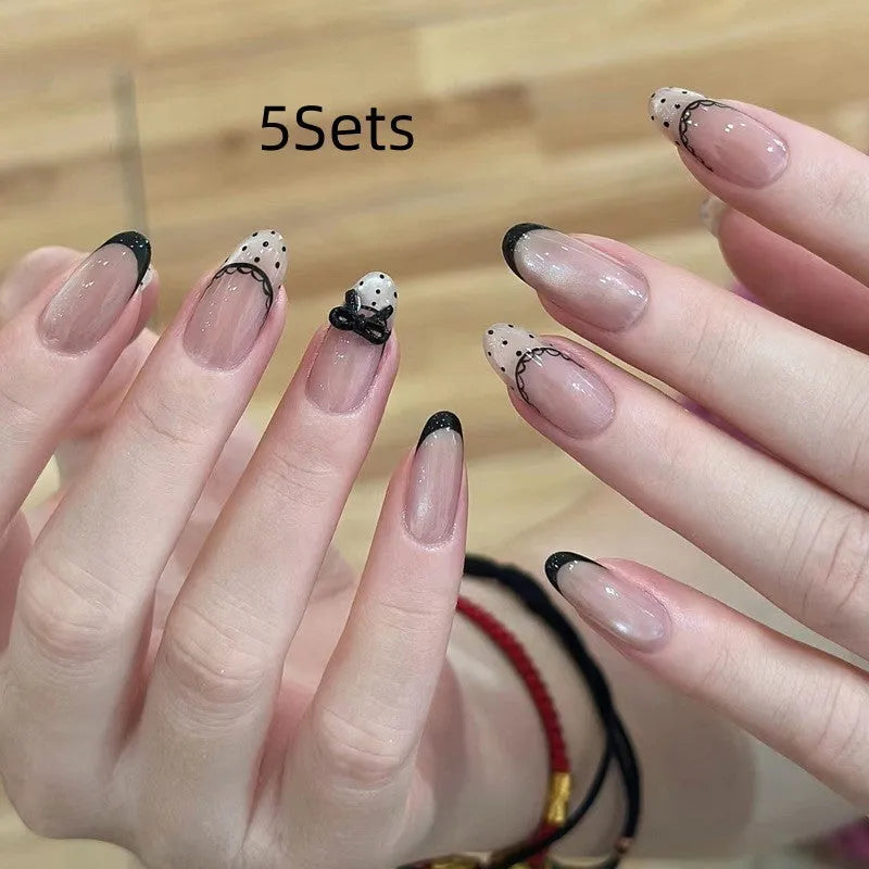 Set of colourful artificial false nails with glitter designs for DIY manicures.