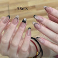 Set of colourful artificial false nails with glitter designs for DIY manicures.