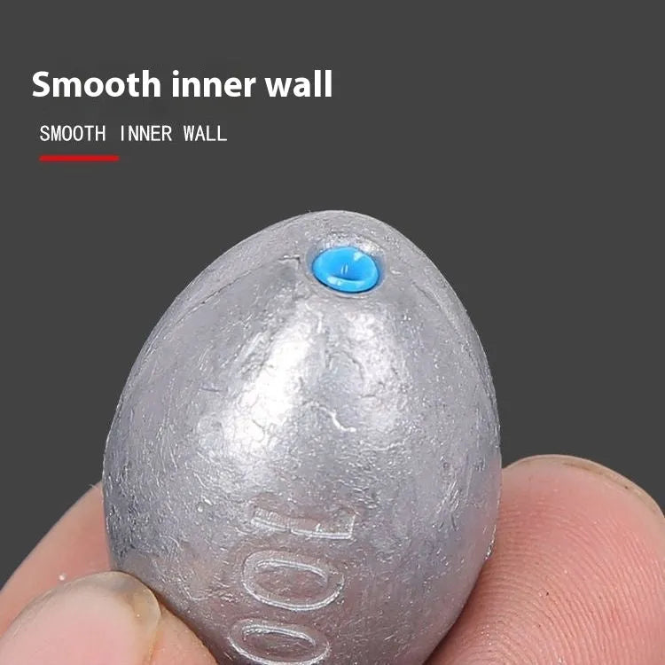 Plastic core olive lead sinker with scale tongxin pattern and rugby shape for sea fishing