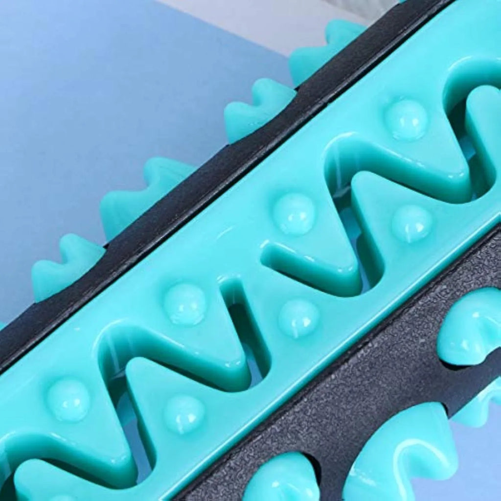 Natural rubber dog toothbrush chew toy in four colours: black/blue, blue, green, and yellow