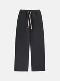 Men's grey fleece-lined sweatpants with drawstring waistband and loose fit design