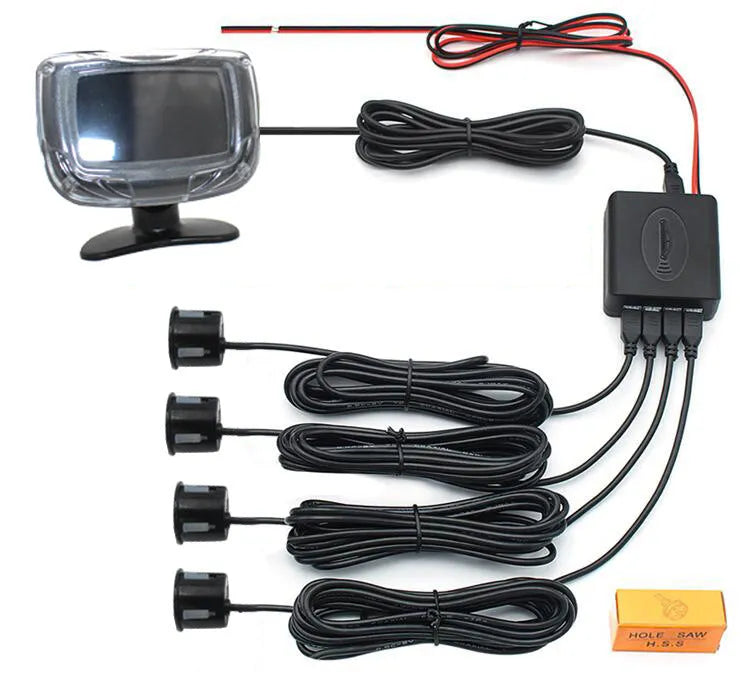 Wireless reversing sensor kit showing main unit, four round probes, LED display, hole opener, and cables on a white background.