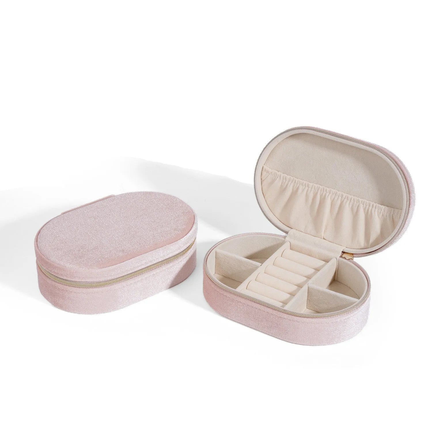 Oval shaped velvet jewellery storage box in multiple colours with flannel interior, measuring 15 by 10 by 5 cm.
