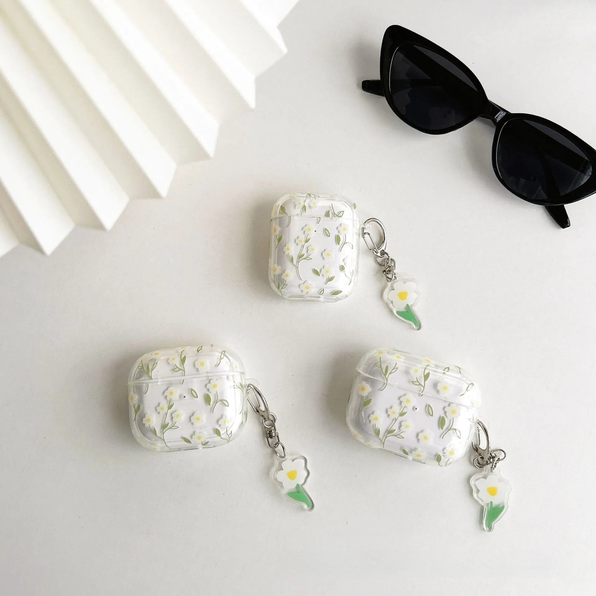 White floral transparent TPU protective case for Apple AirPods showing floral pattern details