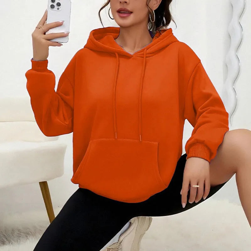 Women's loose drawstring pocket sweatshirt in various colours showing front pockets and adjustable collar