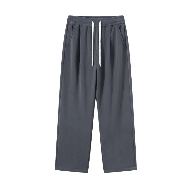 Men's apricot double-sided polar fleece trousers with a wool lining, shown with a drawstring waist.