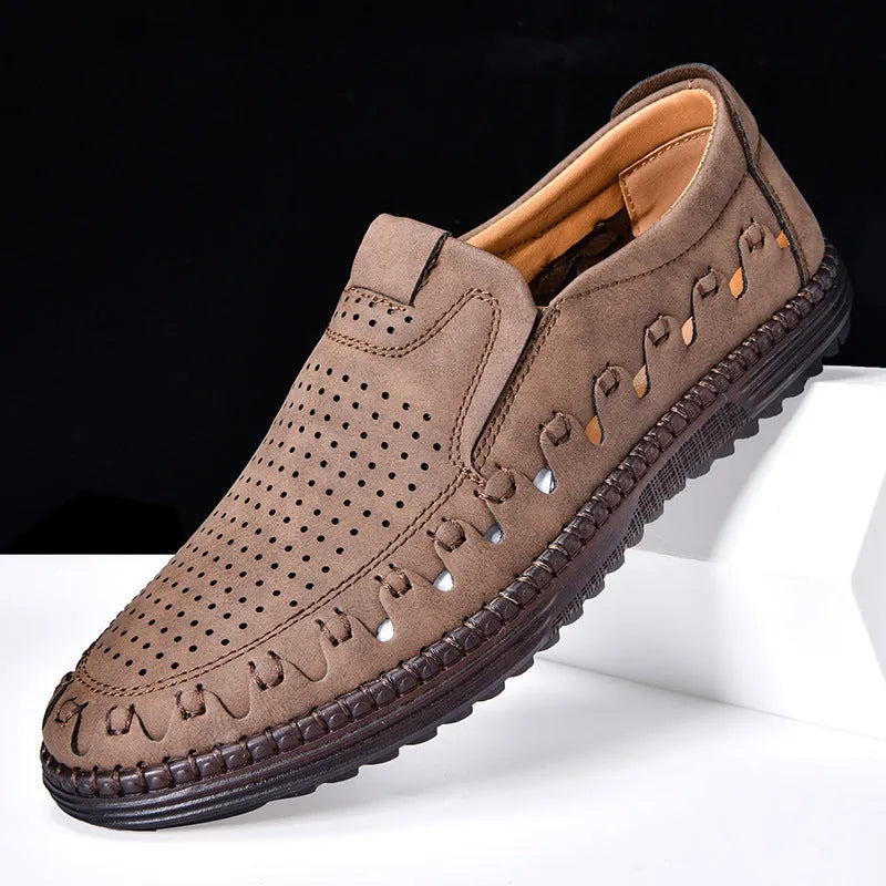 Men's brown slip-on casual shoes with round toe and flat heel on a white background