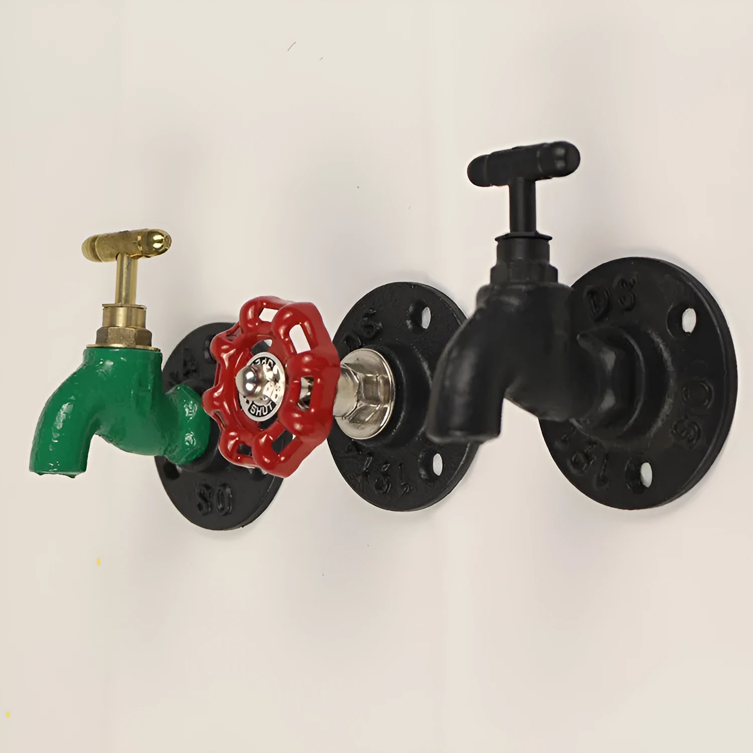 Water pipe style metal towel rack hook mounted on wall with towels hanging