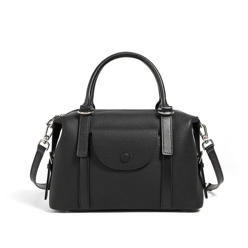 Genuine leather street trend handbag with lock detail and contrast stitching in 27x12x20 cm size
