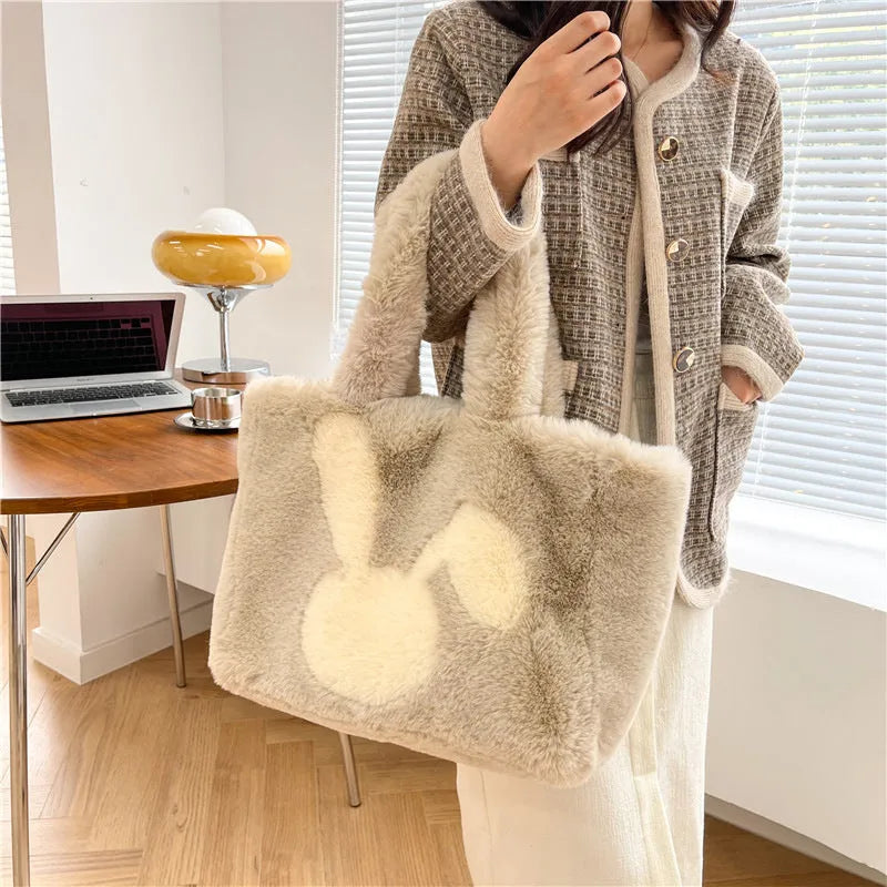 Cute cartoon rabbit ears plush shoulder tote bag in a solid colour.