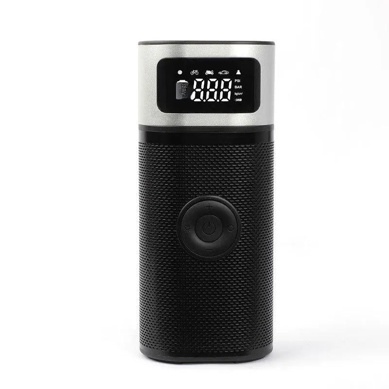 Black portable wireless car air pump with a digital display, inflation hose, and a set of nozzles on a black background.