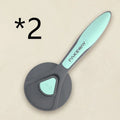 Pet floating hair combing brush in mint green, engineering plastic handle, 193mm length on white background