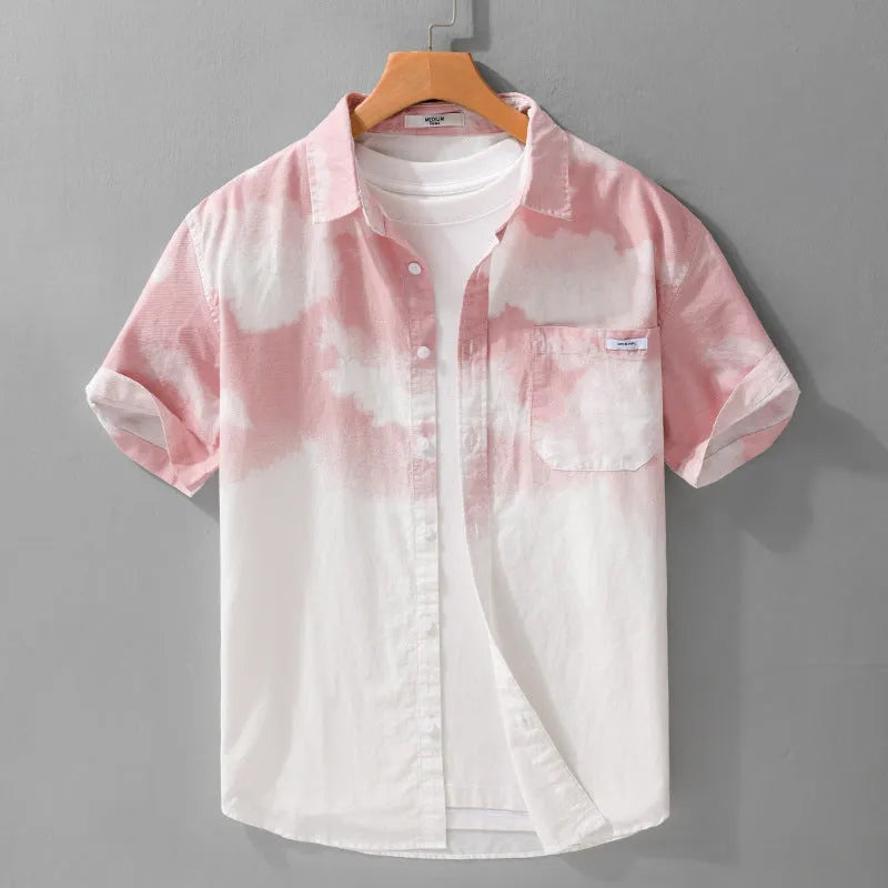 Man wearing a light pink loose-fit short-sleeved cotton shirt, casual summer style