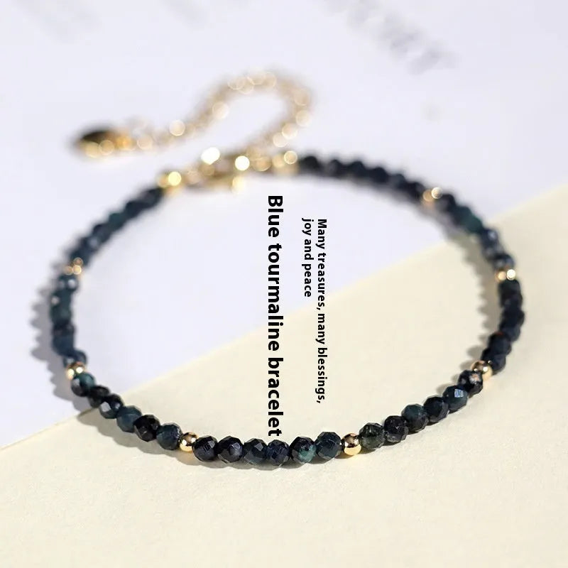 Women's blue tourmaline bracelet with 3mm beads and spacer design
