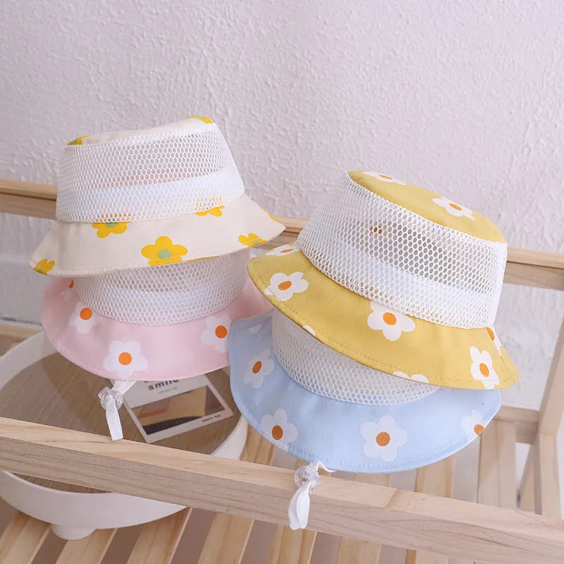 Floral baby bucket hat in blue with mesh fabric, side view showing brim and weft-knitted texture