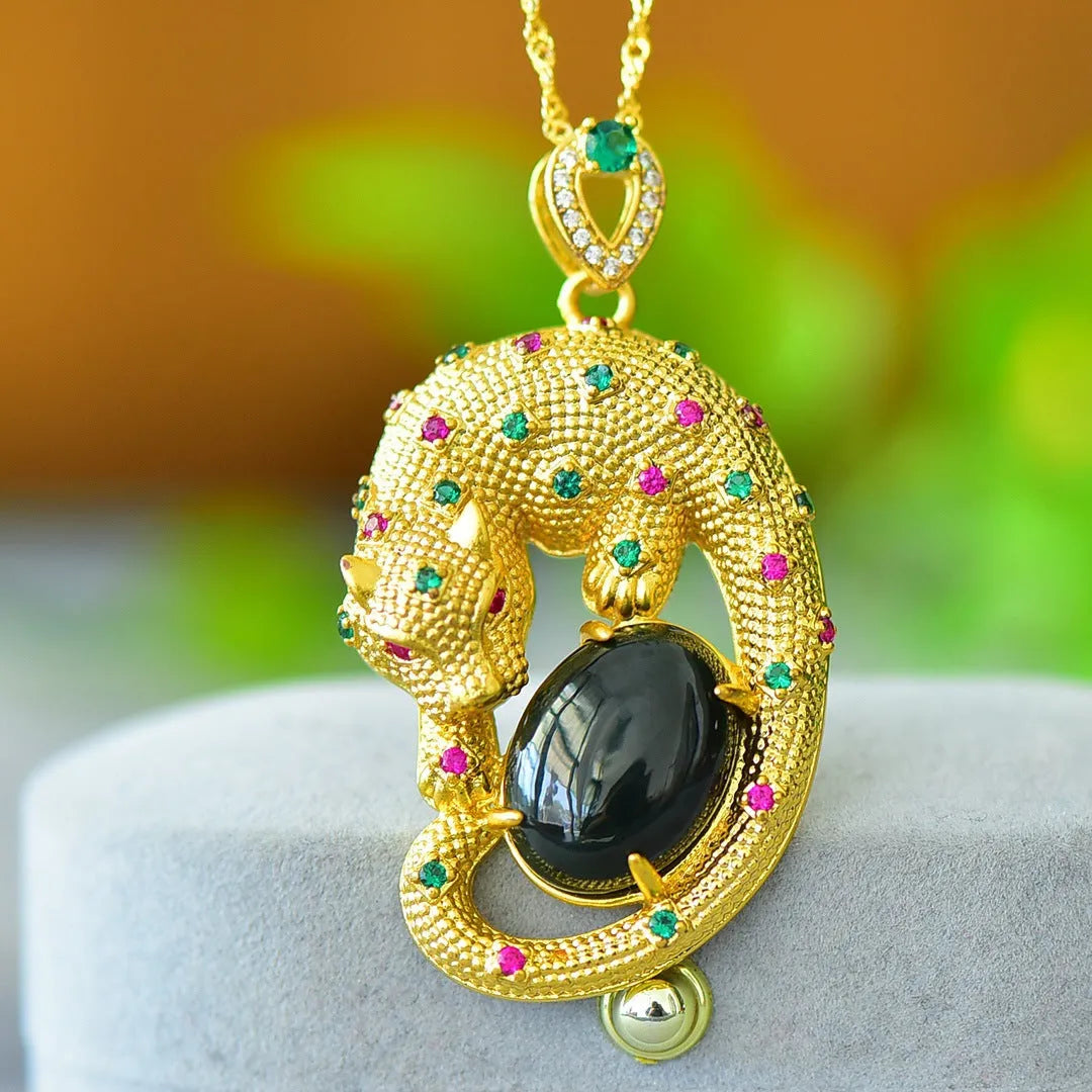 Close-up of a natural Hetian jade pendant with intricate copper inlay detail on a necklace chain.