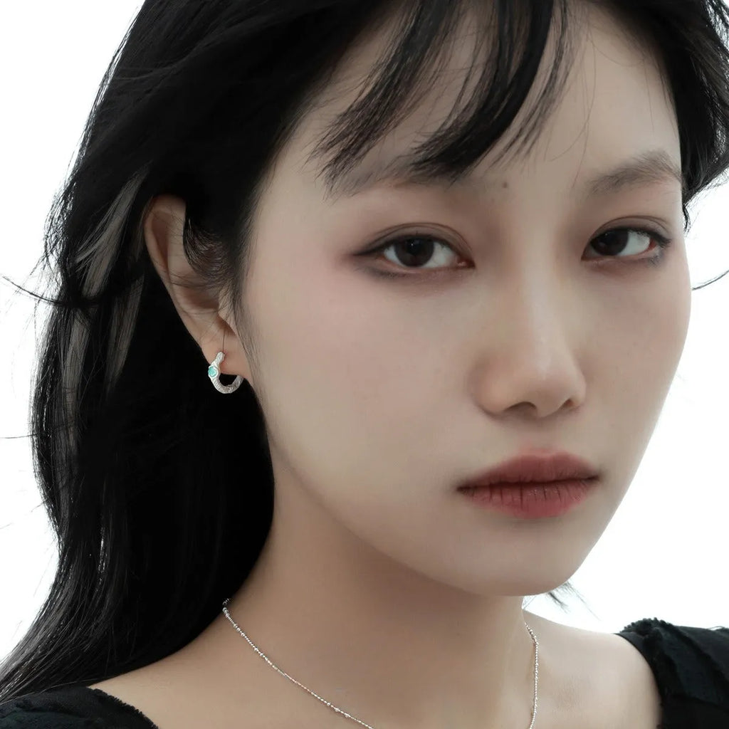 Geometric burnt silver ear clip for women with round elements made from 925 sterling silver