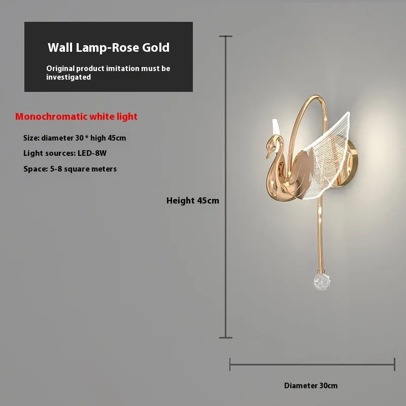 Gold swan-shaped wall lamp with acrylic shade and dimmable LED light.