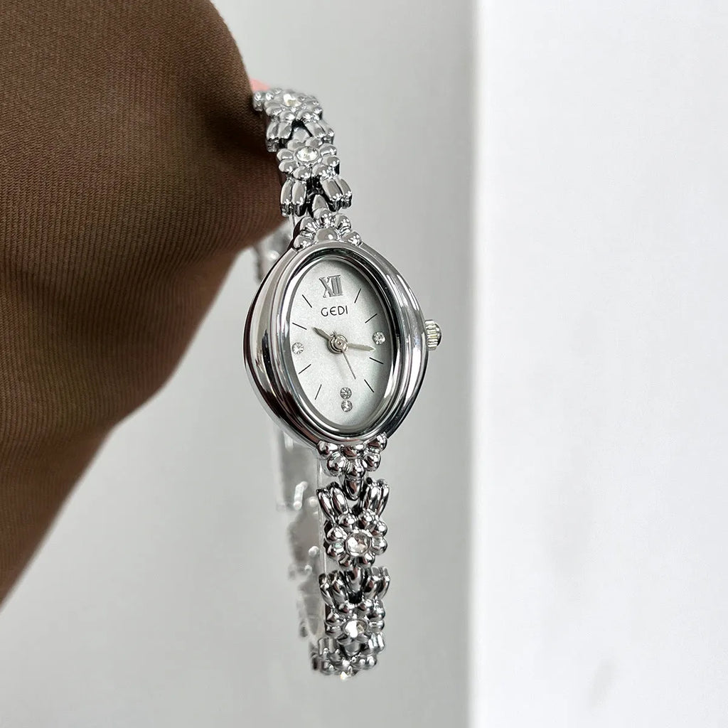 Women's light luxury retro compact alloy watch with 8mm thin case and white dial on white strap