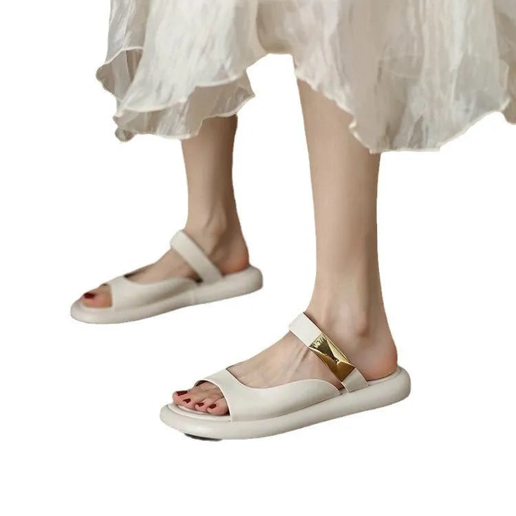 Women's apricot and white peep toe flat platform sandals with a rubber sole.
