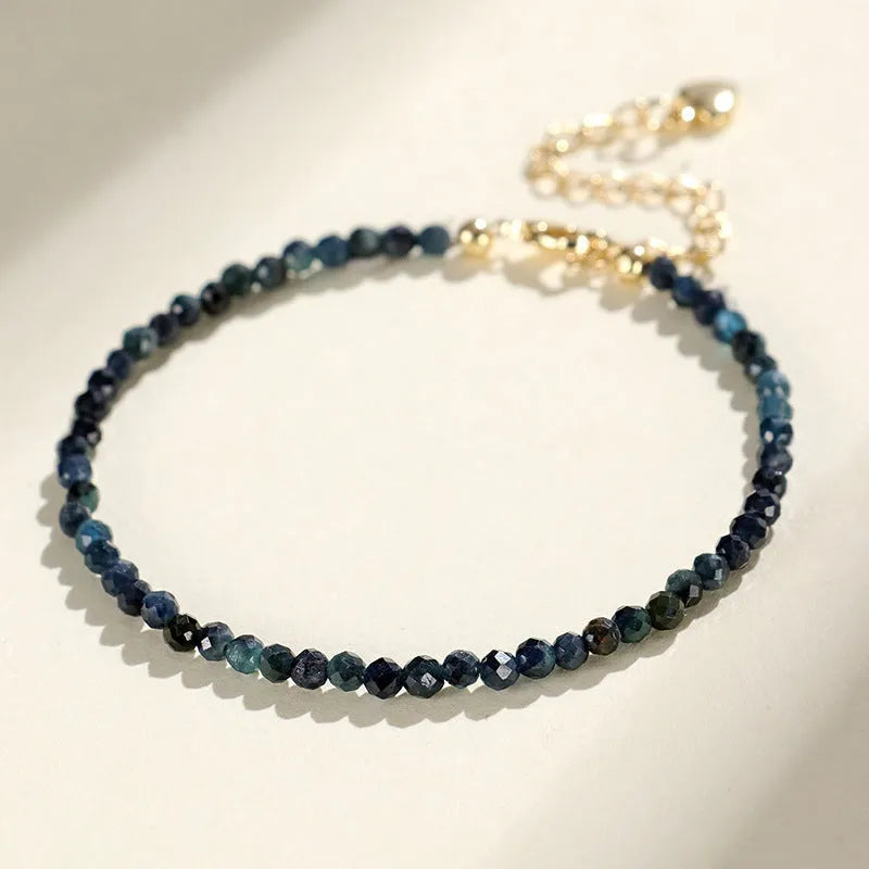Women's blue tourmaline bracelet with 3mm beads and spacer design