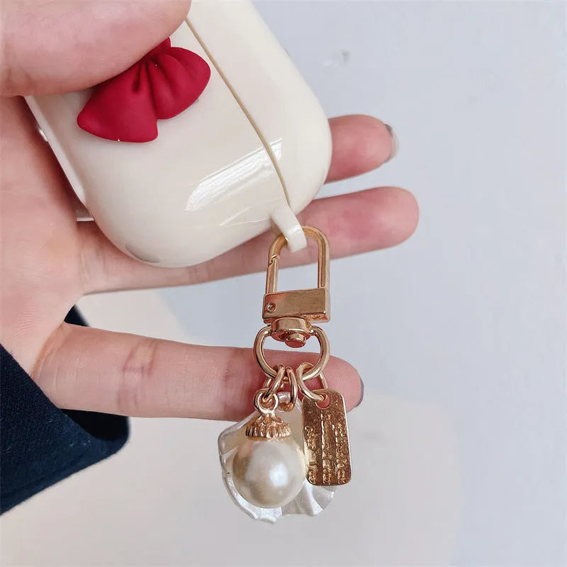 Beige red bow shell TPU protective case cover for AirPods showing clamshell design