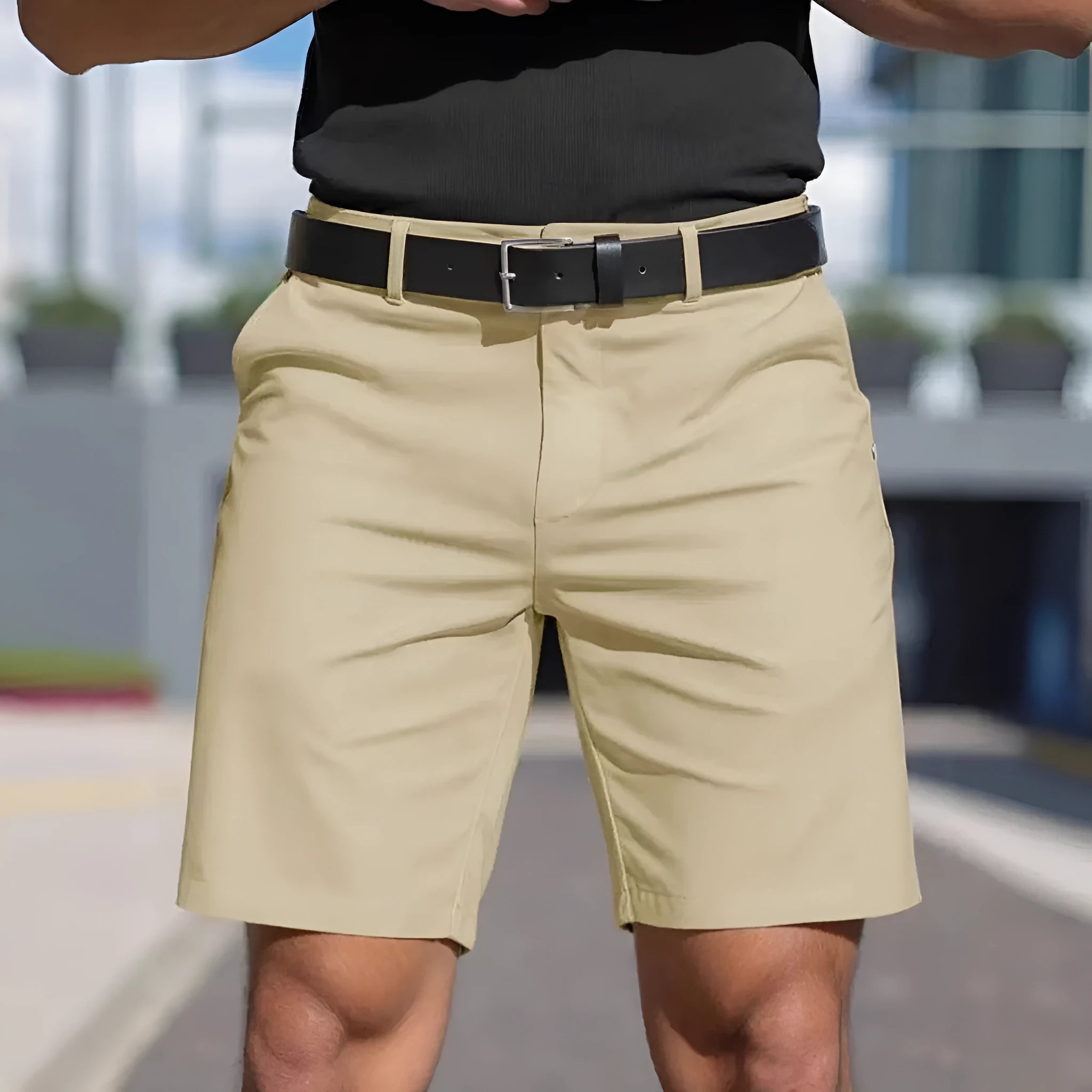 Men's straight cut solid colour shorts in light blue, showing fifth pants length and micro elastic polyester fabric.