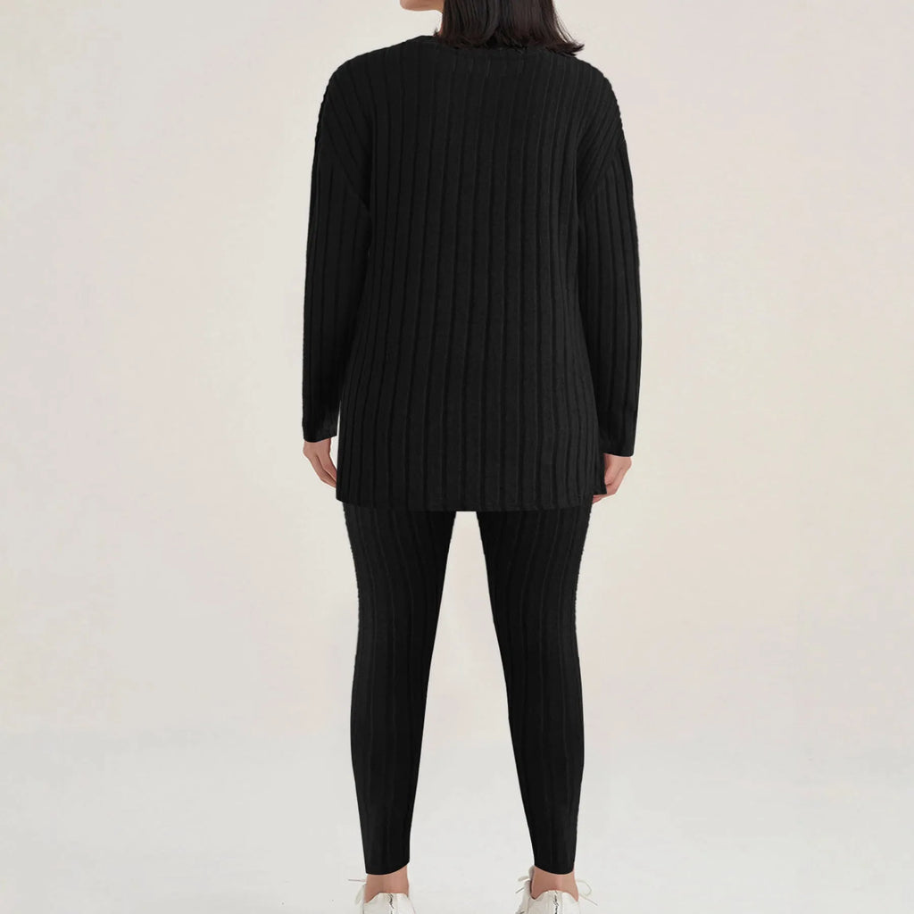 Black sunken stripe two-piece casual homewear set with top and pants on a hanger.