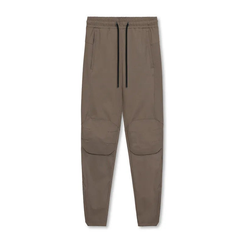 Men's grey ankle-tied running trousers for fitness exercise with quick-dry polyester fabric