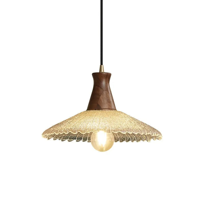 Wood and brass ceiling chandelier with glass lampshade in three available sizes.
