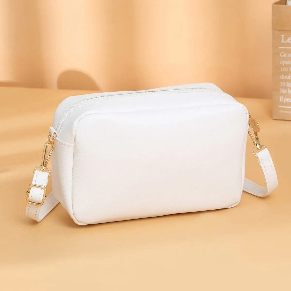 Women's solid colour PU shoulder bag with a three-dimensional pocket and horizontal square shape.