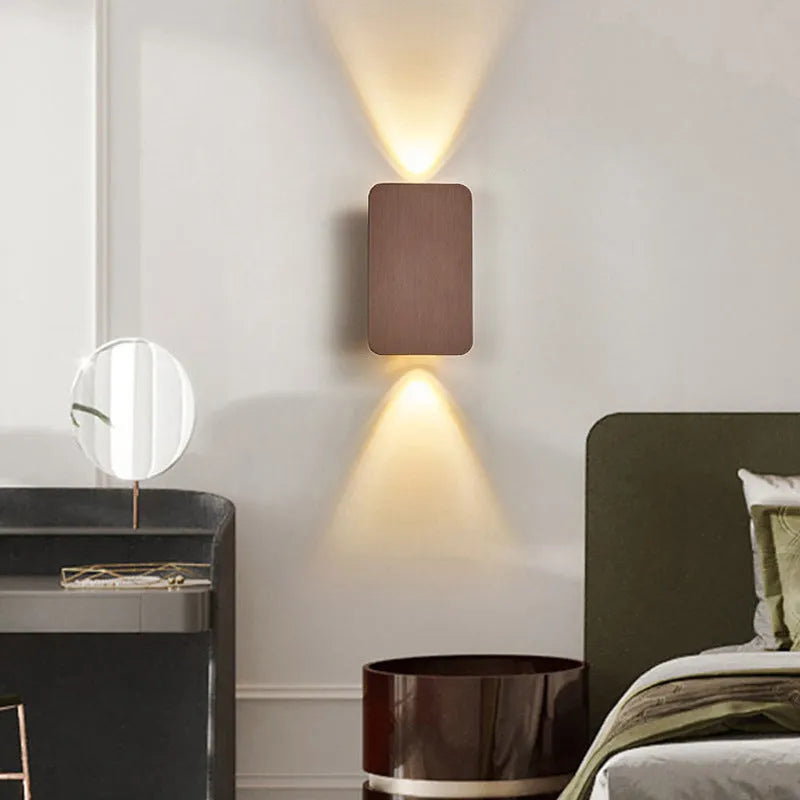 Slim minimalist Nordic-style LED wall lamp mounted on a wall, shown in a choice of colours and sizes.