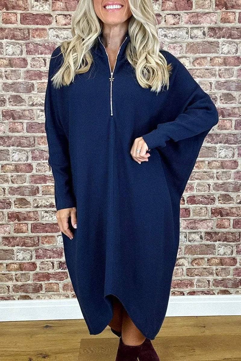 Women's solid colour loose knitted dress with raglan sleeves and a zipper detail.