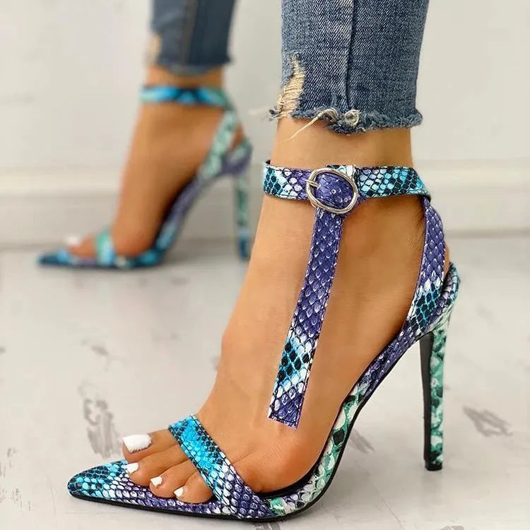 Blue women's high heels with buckle fastening and pointed toe in artificial leather