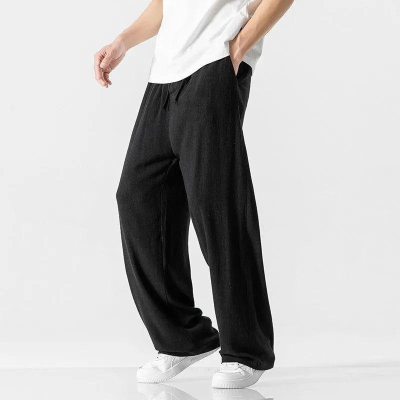 Men's cropped linen trousers in bamboo fibre with a loose straight-leg fit and drawstring waist.